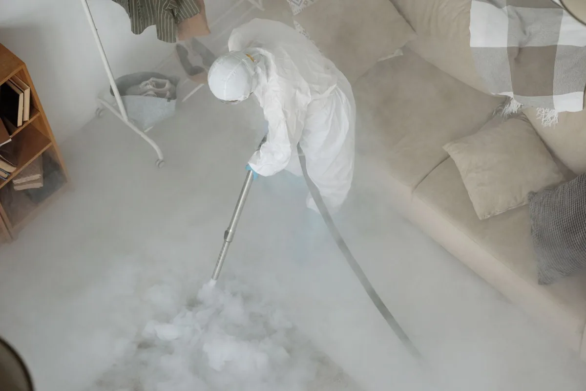 Biohazard cleanup technician in protective equipment, Rogers City, MI